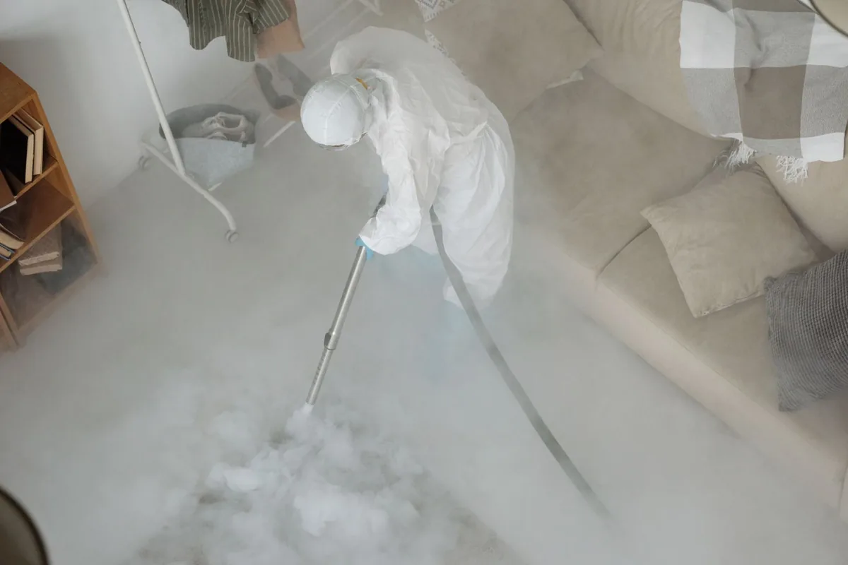 Biohazard cleanup technician in protective equipment, Ardmore, AL